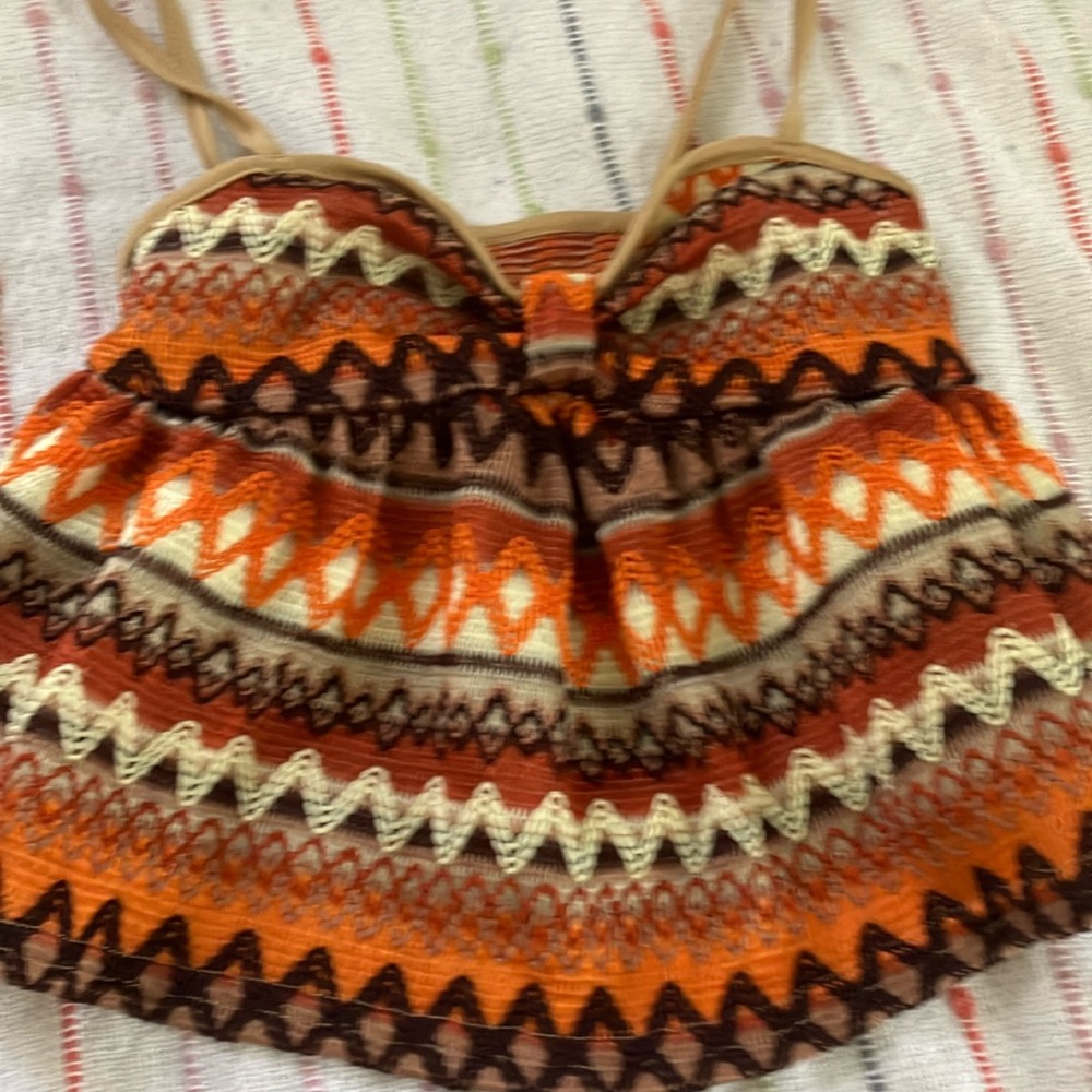 I am selling a multi color orange combo baby tank top